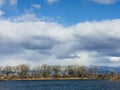 Clouds over a western Colorado lake with the Grand Mesa in the Background Royalty Free Stock Photo