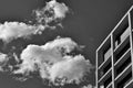 Clouds and partial view of a building with balconies