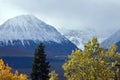 Clouds partially obscuring front range of St Elias Mountain range