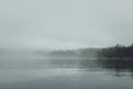 Fog over the lake. Early morning on Ladoga lake in Karelia, Russia. Royalty Free Stock Photo