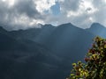 Through the clouds, the rays of the sun break through the mountains. Rosa Khutor Royalty Free Stock Photo