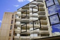 Clouds reflected in the glass office building in city street Royalty Free Stock Photo