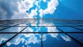 Clouds reflected on modern office building glass facade Royalty Free Stock Photo