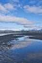Clouds reflected in water at low tide Royalty Free Stock Photo