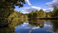 Clouds reflected in the waters of a wetland conservation area