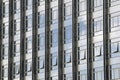 Clouds reflected in windows of modern office building Royalty Free Stock Photo