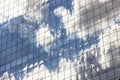 Clouds Reflected in Windows of Modern Office Building Royalty Free Stock Photo