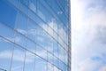 Clouds reflected in windows of modern office building Royalty Free Stock Photo