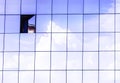 Clouds reflected in windows of modern skyscraper office building. Royalty Free Stock Photo