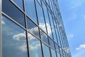 Clouds reflected in windows of office building Royalty Free Stock Photo