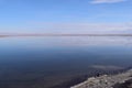 clouds reflecting in the blue waters of the chaxa lagoon in the altiplano