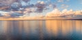 Clouds reflecting in calm sea. Royalty Free Stock Photo