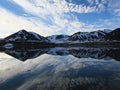 Clouds reflecting in calm waters, Svalbard, Norway