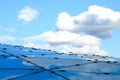 Clouds reflecting on the roof