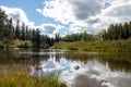 Clouds reflecting in water in the Depew River, Ontario, Canada Royalty Free Stock Photo