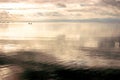 Clouds reflecting in the waters of the lake at sunset Royalty Free Stock Photo