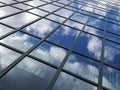 Clouds Reflecting in Windows of Tall Office Building Royalty Free Stock Photo