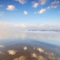 Clouds and reflection at the beach Royalty Free Stock Photo