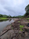 Clouds river bridge and green hills during monsoon