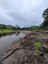 Clouds river bridge and green hills during monsoon