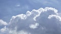 Clouds roiling in transition from storm clouds to blue sky