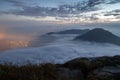 Clouds rolling over a mountain on Lantau Island at dawn Royalty Free Stock Photo