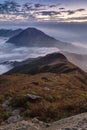 Clouds rolling over mountain on Lantau Island at dawn Royalty Free Stock Photo