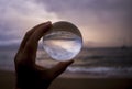 Clouds and Seascape as Storm Approaches Captured in Glass Ball R Royalty Free Stock Photo