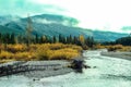 Clouds and setting sun above mountainsFall starts to settle in K Country. Kananaskis,Alberta,Canada Royalty Free Stock Photo