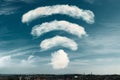Clouds in the shape of a WiFi symbol on a sky background. Dreaming of better WiFi, or excellent signal coverage concept.