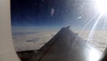 Clouds and sky as seen through window of an aircraft Royalty Free Stock Photo