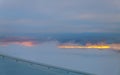 Clouds and sky as seen through window of an aircraft at sunset Royalty Free Stock Photo