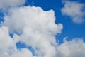 Soft white clouds in a brilliant blue sky Royalty Free Stock Photo