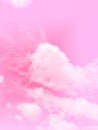 Clouds and sky with pastel pink colored background. There is a deep pink color in the middle of the cloud. Royalty Free Stock Photo