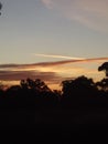 Streaky Orange Clouds with Airoplane Trail