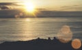 Clouds sky and sunlight sunset on horizon ocean. Silhouette person on background seascape dramatic atmosphere rays sunrise. Relax