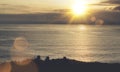 Clouds sky and sunlight sunset on horizon ocean. Silhouette person on background seascape dramatic atmosphere rays sunrise. Relax