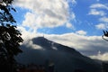 The tower on the mountain among the clouds. Royalty Free Stock Photo
