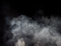 Clouds of smoke swirl on a dark background Royalty Free Stock Photo