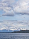 Clouds and snow covered mountains in the Lynn Canal in Southeast Alaska