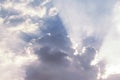 Clouds and sun shines through rays of light in the illuminated p Royalty Free Stock Photo