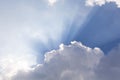 Clouds and sun shines through rays of light in the illuminated p Royalty Free Stock Photo