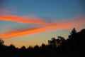 Clouds at sunrise colored sun rays