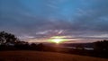 Clouds and sunset over the fields.