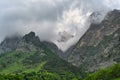 Clouds swirl over the Tsey-Loam mountain ridge