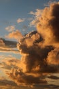 Clouds tinged with colored light from setting sun