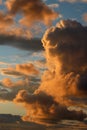 Clouds tinged with colored light from setting sun Royalty Free Stock Photo