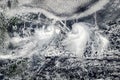 Clouds with tornadoes, view from space