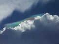 Clouds under a beautiful blue sky reveal an unexpected color