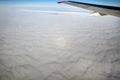 Clouds view from the airplane, Flying over the evening timelapse clouds with the late sun. Flight through moving cloudscape with b Royalty Free Stock Photo